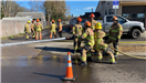 Firefighters Hosing Down Something Offscreen