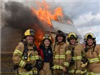 Firefighters small Group Photo in front of Burning Building