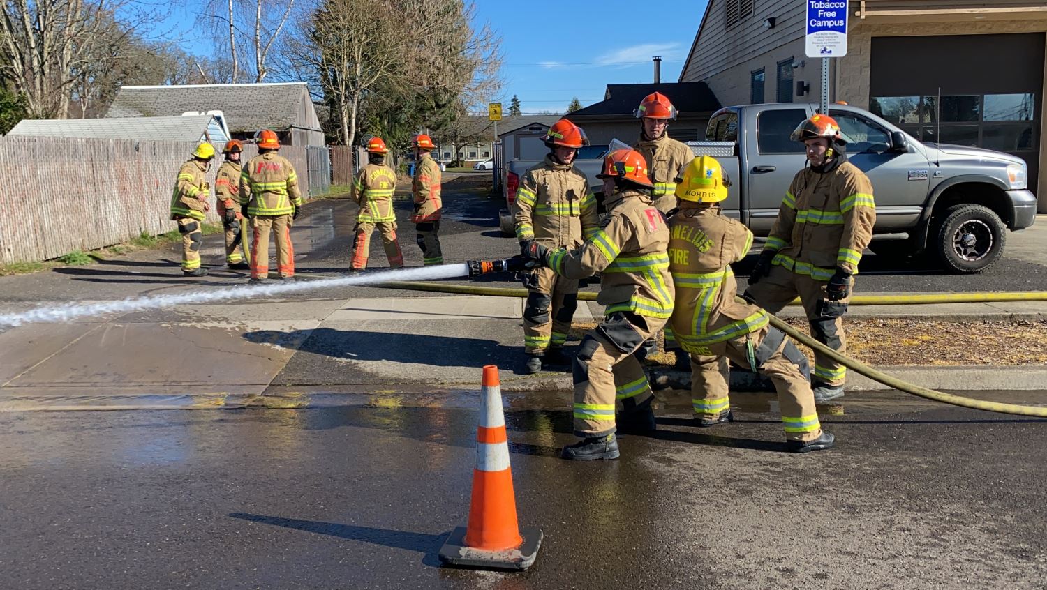 Firefighters Hosing Down Something Offscreen