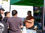Cornelius Farmers Market Community Members Visiting a Vendor Stand